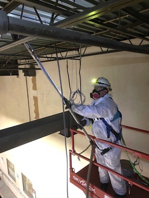 removal of metallic dust from overhead warehouse structural members