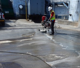 Cleaning fuel stains from concrete with HC-2000