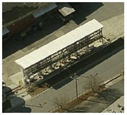 Aerial of Tanker Loading Rack with Rectangular Detention Box Under Canopy and Secondary Containment Pipe Trench in Entrance Road