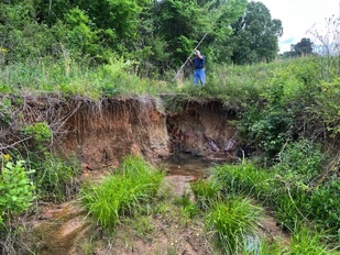 stormwater erosion of pond dam